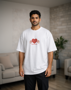 Man wearing a white t-shirt with a red graphic design in a casual setting
