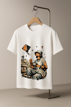 White t-shirt with a graphic design of a person with a kite on a hanger against a beige background